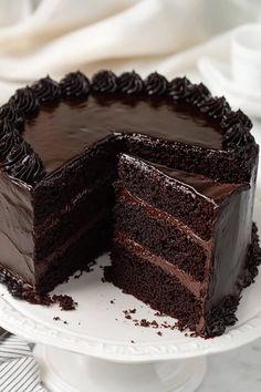 a chocolate cake with one slice missing from it