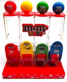 the m & m candy machine is colorfully decorated