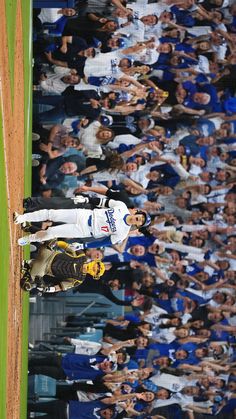 a baseball player standing on top of a field