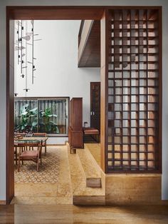 an open room with stairs leading to the second floor and dining table in the center