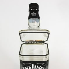 a bottle of jack daniels whiskey sitting on top of a table