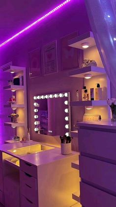 a bathroom with purple lighting in the ceiling