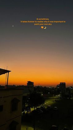 the sun is setting over a city with cars parked on the street and buildings in the background