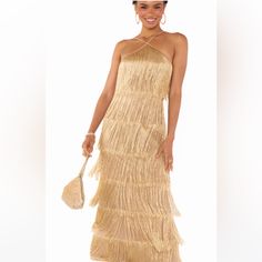 Party Like It's 1922 In The Gatsby Maxi Dress. This Elegant Party Dress Boasts Layers Of Dramatic Gold Fringe That Shimmers As You Move. Let The Dress Be The Statement With Dainty Jewelry And Strappy Heels. Fringe Show, Great Gatsby Dresses, Elegant Party Dress, A Night At The Opera, Gold Cocktail Dress, Gatsby Dress, Gold Fringe, Elegant Party Dresses, Dress Gold