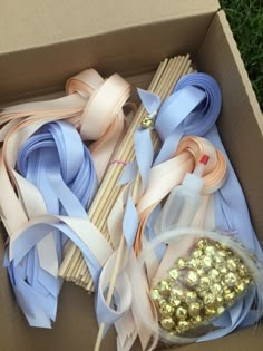 a box filled with lots of different colored ribbons