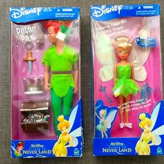 two toy tinkerbell dolls in their packaging