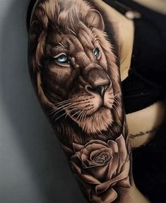 a woman's arm with a lion and rose tattoo on the left side of her body