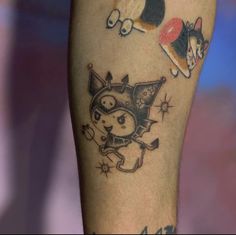 a dog and cat tattoo on the leg