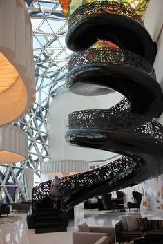 a large spiral staircase in the middle of a building