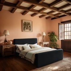 a bed sitting in a bedroom next to a window on top of a hard wood floor