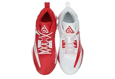 a pair of red and white tennis shoes