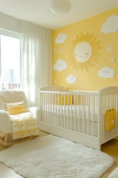 a baby's room with yellow walls, white furniture and a sun painted on the wall