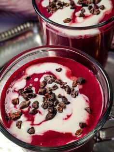 two glasses filled with red and white liquid