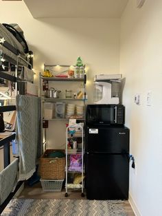 a refrigerator freezer sitting inside of a kitchen