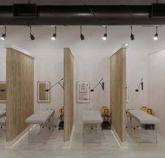 an empty room with several tables and chairs in it, all lined up against the wall