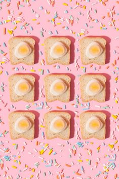 toast with eggs and sprinkles on a pink background surrounded by donuts