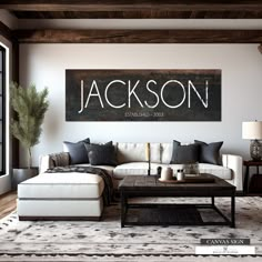 a living room filled with furniture and a large sign on the wall above it that says jackson