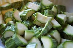 sliced up cucumbers in a white bowl