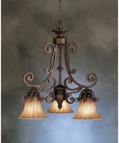 a chandelier with three lights hanging from it's sides and two lamps on each side