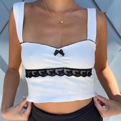 🤍 white coquette pointelle knit top handmade! 🤍 lacy white crop top 🤍 white pointelle Top with black lace detailing & black bow 🤍 y2k Summer top free shipping to US + CAN, msg for int'l orders ☁️ please allow 1 week for shipping as orders are handmade 🫶🏻 wearing size S S - 32" bust M - 34" bust L - 36" bust Trendy White Lace Top, Trendy Fitted White Crochet Top, White Lace Crop Top For Spring, Trendy White Fitted Crochet Top, White Lace Crop Top For Summer, White Y2k Style Crop Top For Spring, Trendy White Tank Top With Lace Trim, White Lace Cropped Top, Fitted Cropped Crop Top With Pointelle Knit