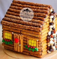 a gingerbread house made out of pretzels and candy