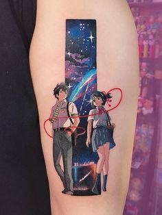 an arm tattoo with two anime characters and a star in the sky on it's side