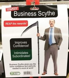 a man in a suit holding a giant schleife with the words business scythe on it