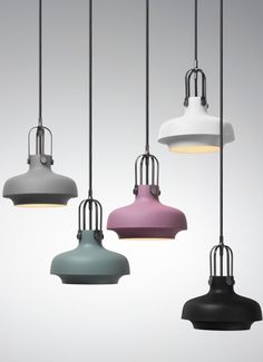 five different colored lamps hanging from the ceiling