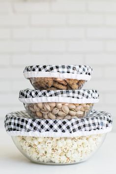 three bowls filled with different types of food