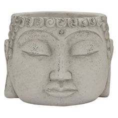 a white buddha head planter with eyes closed in front of a white background,