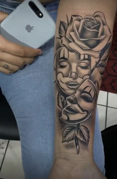 a woman's arm with a tattoo on it and a rose in the center