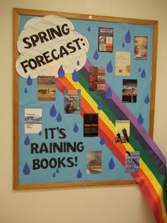 a bulletin board with books on it that says spring forecast, it's raining books