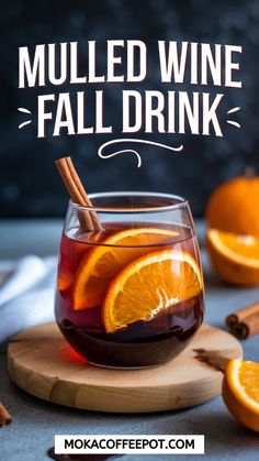 mulled wine fall drink with orange slices and cinnamon sticks