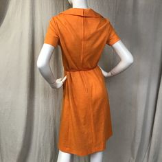 "This is a lovely short sleeve dress in a bright cheery tangerine. There's a zipper (19\") down the back with hooks at the top for the collar. The sleeves are short. There are two pockets at the waist. The belt is included. Details Size: unmarked, fits a modern 4 - 6 Bust: 36\" Sleeve length: 7\" Shoulder: 14.5\" Waist: 32\" Hips: 36\" Length: 41\" Belt: 26\" - 31\" Label: unmarked Colors: Tangerine Condition: Excellent, no issues." Mod Style, Mod Fashion, Dress Short Sleeve, Mod Dress, Orange Dress, Short Sleeve Dress, Dress Short, Sleeve Dress, Wrap Dress