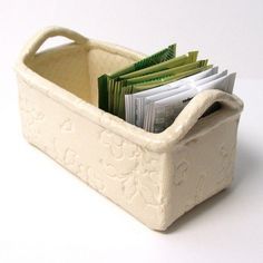 a white container filled with lots of papers