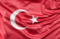 the flag of turkey is flying in the wind with silky folds and stars on it