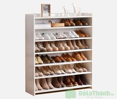 a white shoe rack filled with lots of shoes