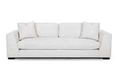 a white couch with pillows on it