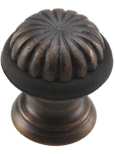 an antique bronze knob with black accents