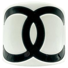 A stunning oversize Chanel Monochrome CC Cuff from the 2000s. Crafted in resin. Featuring a gigantic bold black interlocking CC logo on a white background to create a seriously iconic monochrome cuff. In very good condition, signed, approx. 6cm deep, internal diameter approx. 6cm, opening/gap approx. 2.8cm. A total looker that will forever seal your style with the magic of the House of Chanel. Established in 2016, this is a British brand that is already making a name for itself in the jewellery Chanel Cuff, Chanel Jumbo, Cute Birthday Outfits, The 2000s, Vintage Jewels, Cc Logo, Timeless Treasures, Bold Black, A White Background