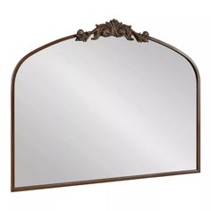 a large mirror with an ornate frame on the top and bottom part, in bronze