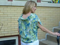 a woman is walking down the stairs with her hand on an open door handle,