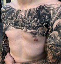 a man with tattoos on his chest and shoulder