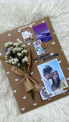 a brown card with pictures and flowers tied to it