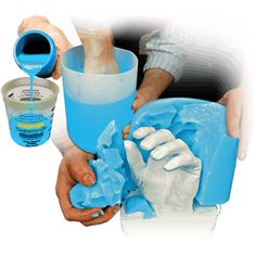 two hands are holding blue paint and one is pouring it into a cup with the other hand