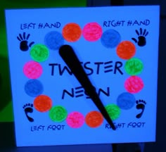 a clock made out of colored paper with the words, left hand, right hand and taster new written on it