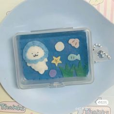 there is a small plastic box with sea animals in it