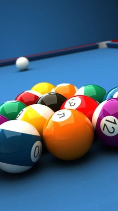 billiards balls lined up on a pool table