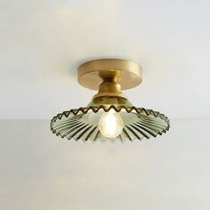 a close up of a light fixture on a ceiling