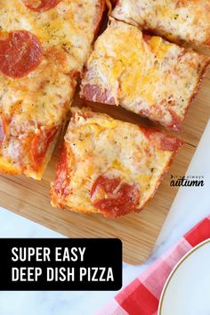 slices of pizza sitting on top of a wooden cutting board